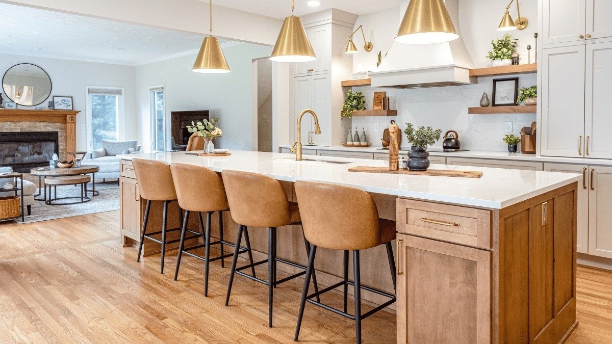 luxury kitchen remodeling project built by Custom Built Design and Remodeling near Dobie Lake in Mason Michigan with quartz island and tile backsplash