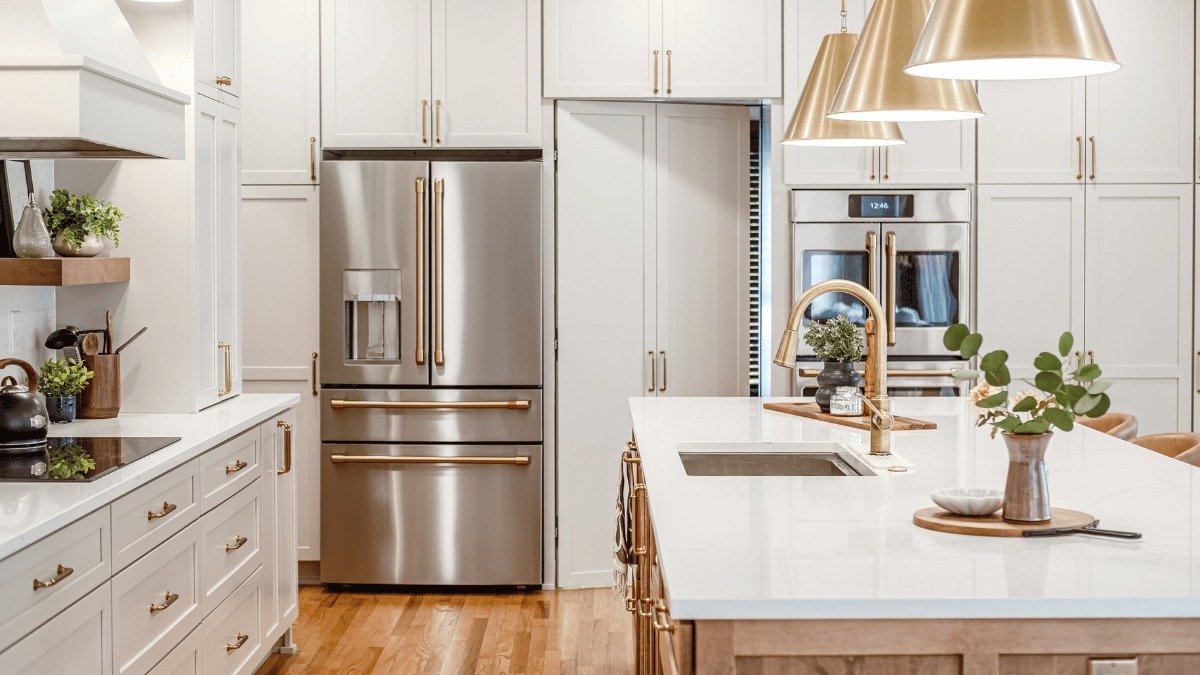 luxury kitchen remodeling project built by Custom Built Design and Remodeling near Dobie Lake in Mason Michigan with tall cabinetry and new refrigerator