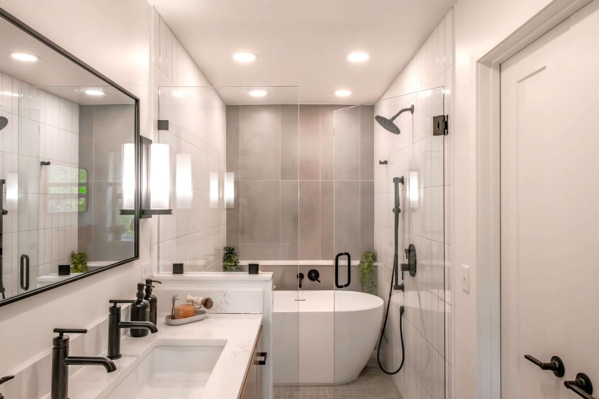 bathroom remodeling project near Lake Lansing Haslett Michigan built by Custom Built and Remodeling with wet room and layered lighting