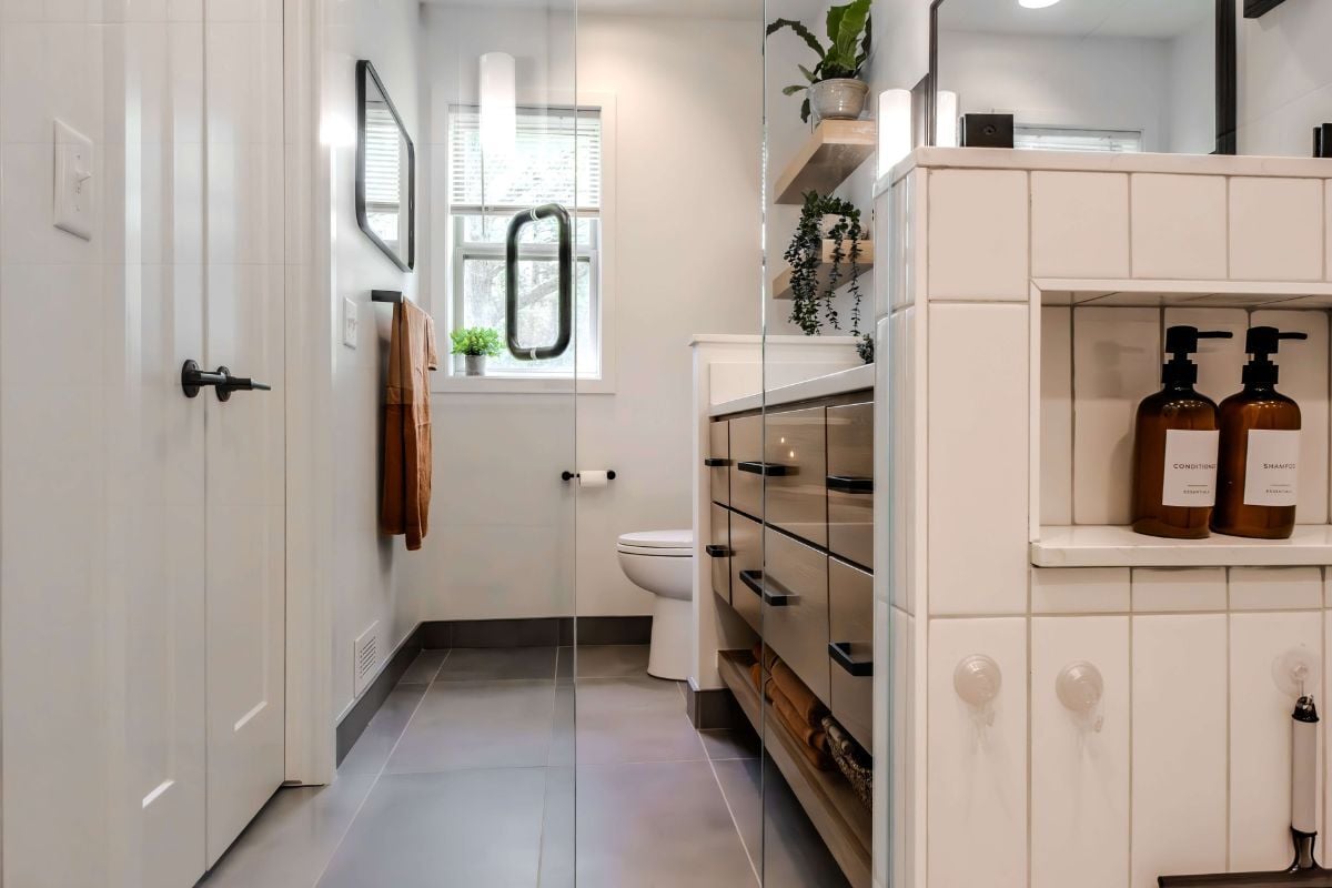 bathroom remodeling project near Lake Lansing Haslett Michigan built by Custom Built and Remodeling with wet room and quartz shower niche