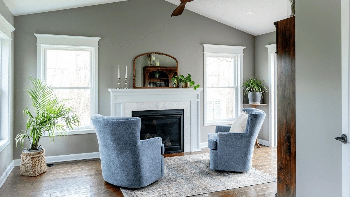 completed four seasons room addition near Kiwanis Park Holt Michigan built by Custom Built Design and Remodeling with luxury vinyl flooring and custom fireplace